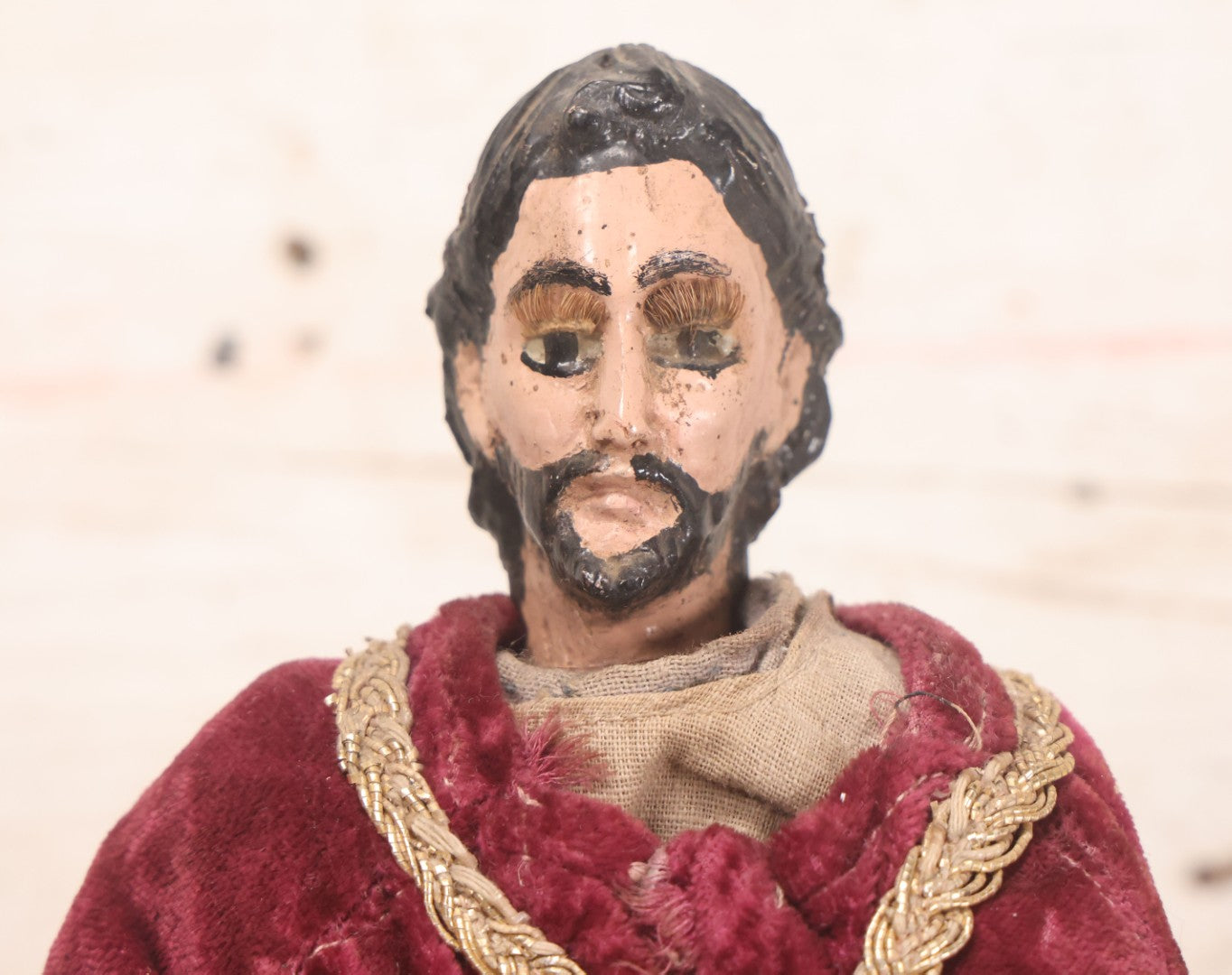Lot 047 - Antique Handmade Religious Saint Statue Santos Figure With Carved Wooden Head, Hand And Feet, Original Paint, Real Hair Eyebrows, And Maroon Velvet Robe, Note Missing Hand, 16" H