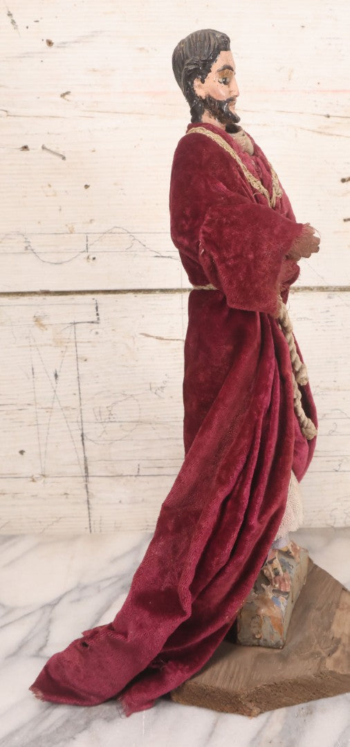 Lot 047 - Antique Handmade Religious Saint Statue Santos Figure With Carved Wooden Head, Hand And Feet, Original Paint, Real Hair Eyebrows, And Maroon Velvet Robe, Note Missing Hand, 16" H