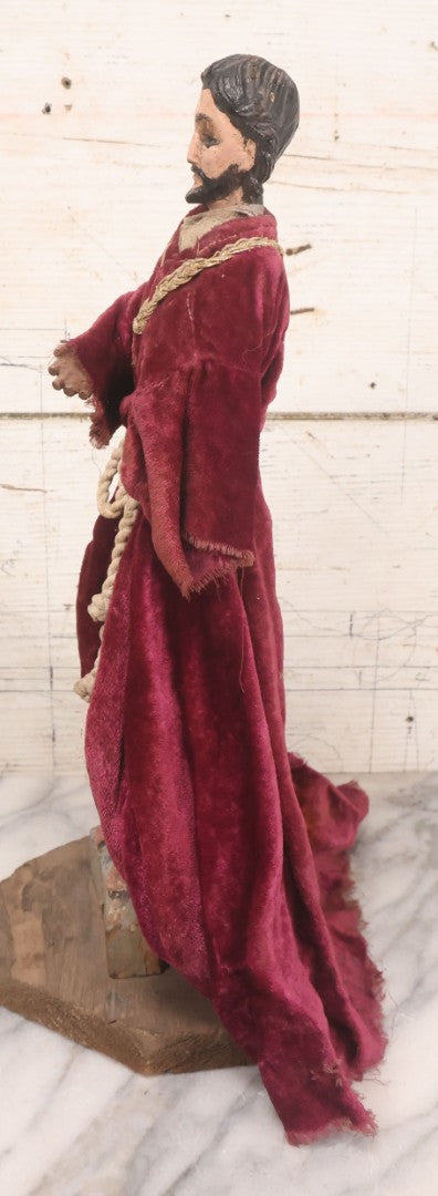 Lot 047 - Antique Handmade Religious Saint Statue Santos Figure With Carved Wooden Head, Hand And Feet, Original Paint, Real Hair Eyebrows, And Maroon Velvet Robe, Note Missing Hand, 16" H