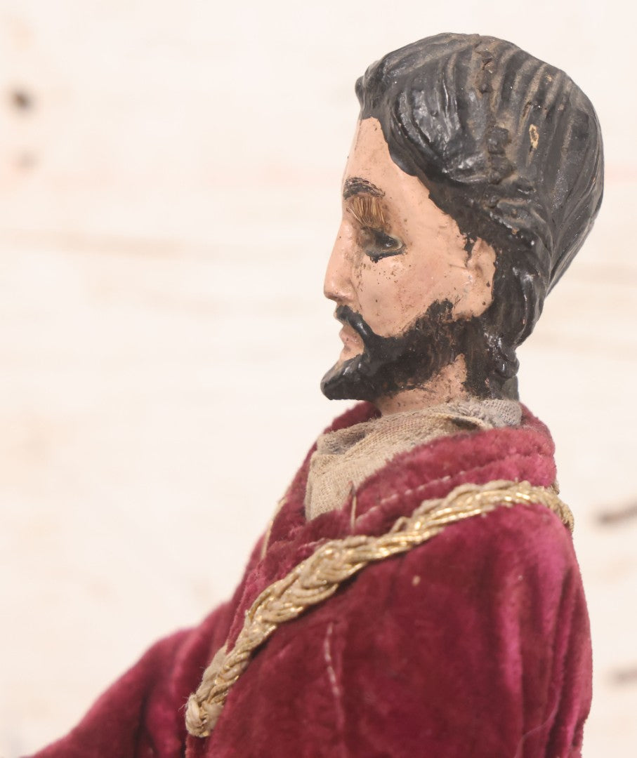 Lot 047 - Antique Handmade Religious Saint Statue Santos Figure With Carved Wooden Head, Hand And Feet, Original Paint, Real Hair Eyebrows, And Maroon Velvet Robe, Note Missing Hand, 16" H
