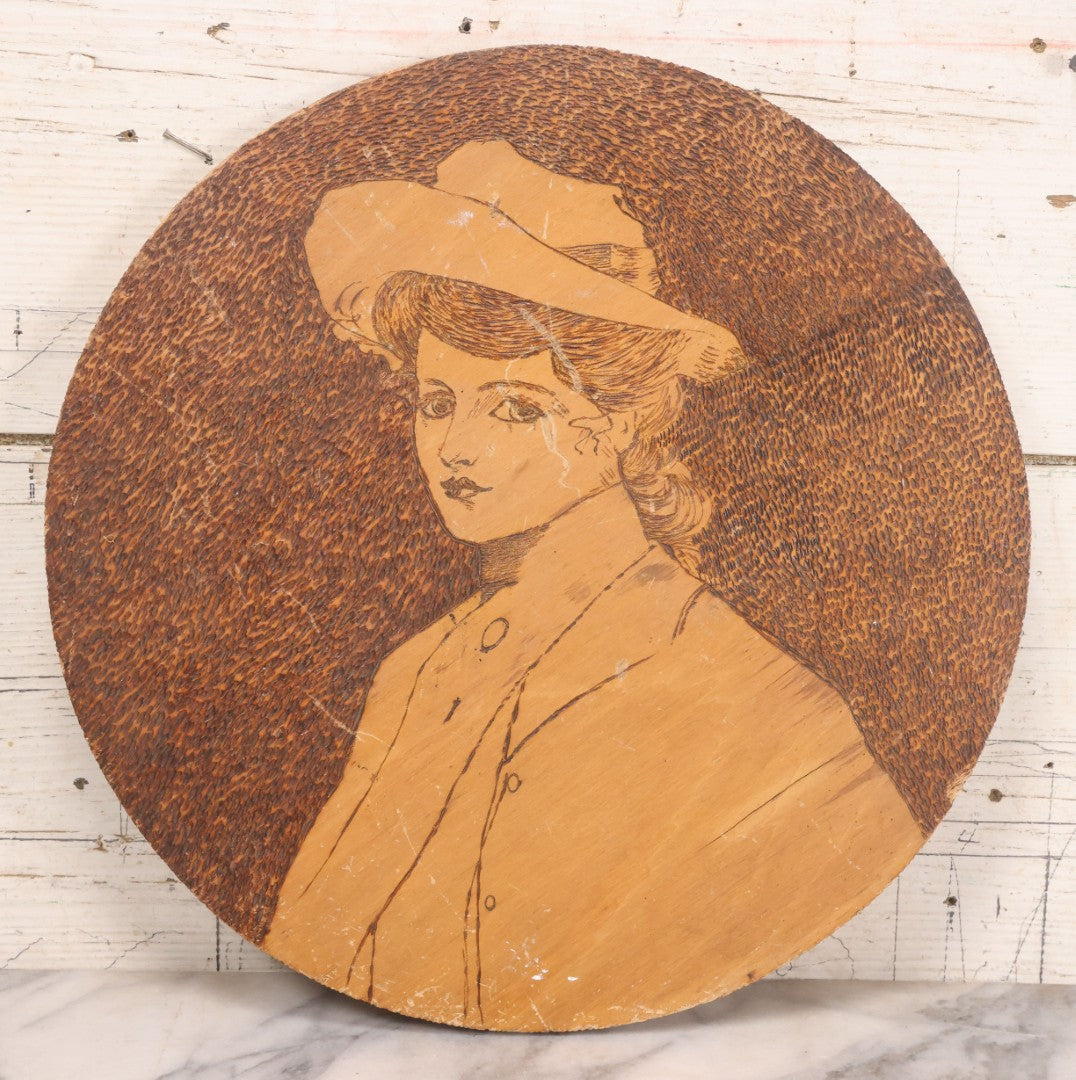 Lot 050 - Antique Pyrography Wood Burned Flemish Art Portrait Of Gibson Girl Style Woman Wearing Hat, Circular Wooden Plaque, 14-3/4" Diameter