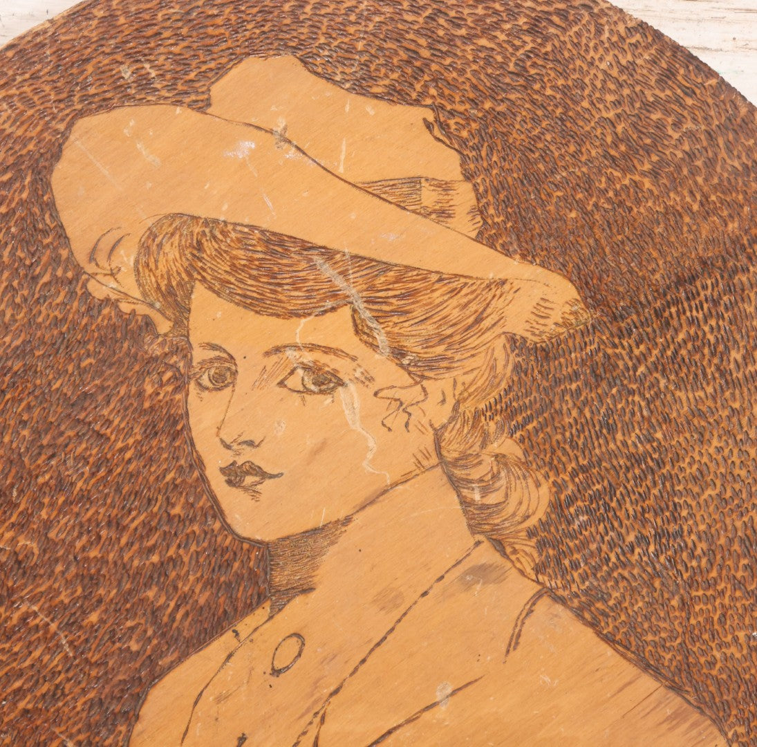Lot 050 - Antique Pyrography Wood Burned Flemish Art Portrait Of Gibson Girl Style Woman Wearing Hat, Circular Wooden Plaque, 14-3/4" Diameter