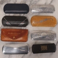 Lot 059 - Grouping Of Eight Vintage And Antique Glasses Cases Including Case With Sunglasses From Dr. Noles Optometrists, Cases From California Optical Co., Dr. Leon Kolb, Decorative Metal Cases, And More