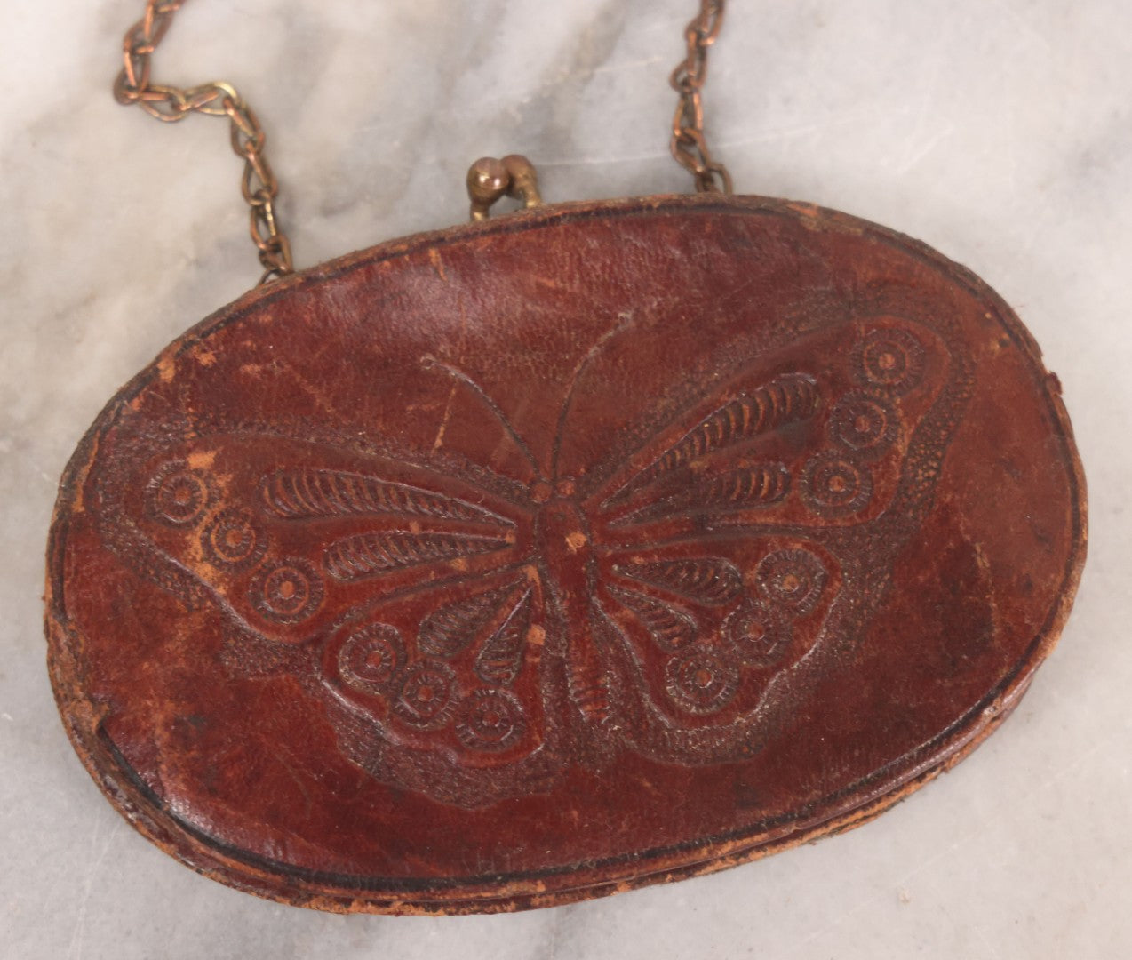Lot 061 - Vintage Tooled Leather Butterfly Coin Purse With Brass Closure And Chain