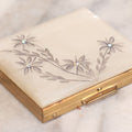 Lot 062 - Vintage S.F. Co., Saks Fifth Avenue Pearlescent Compact With Etched Flowers And Faux Diamonds, Original Powder Pad And Mirror