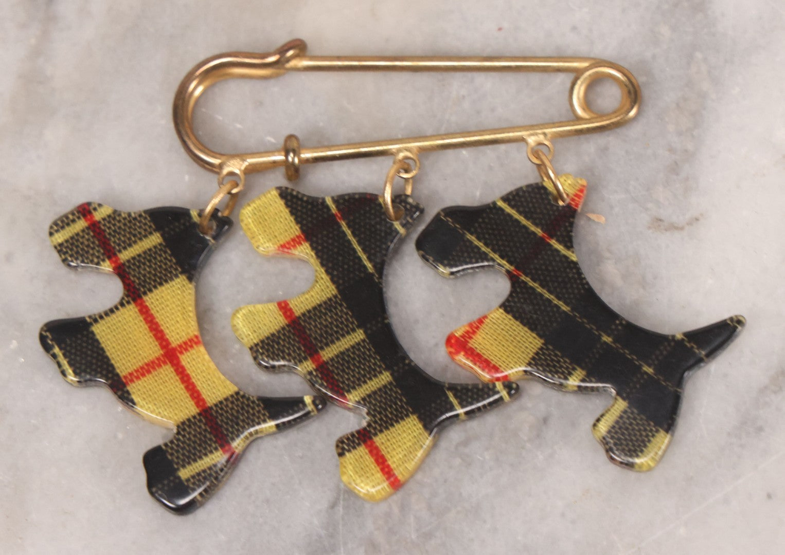 Lot 065 - Vintage Yellow And Black Tartan Scottie Dog Pin With Three Charms