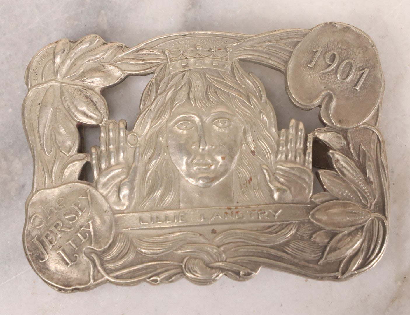 Lot 069 - Vintage Reproduction Lillie Langtry, "The Jersey Lily," British Socialite And Actress, Metal Belt Buckle, Made After The Original 1901 Tiffany Design, 3-1/4" x 2-1/4"