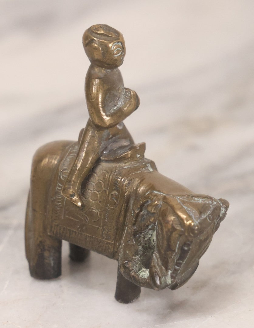 Lot 073 - Vintage Brass Indian Figurine Of Praying Man Riding Elephant, 2-1/8" H