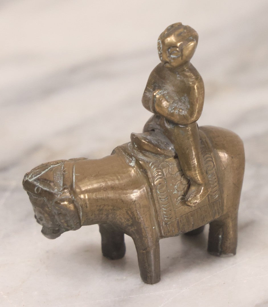 Lot 073 - Vintage Brass Indian Figurine Of Praying Man Riding Elephant, 2-1/8" H