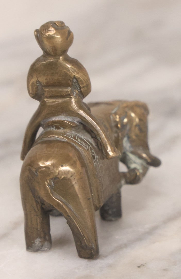 Lot 073 - Vintage Brass Indian Figurine Of Praying Man Riding Elephant, 2-1/8" H