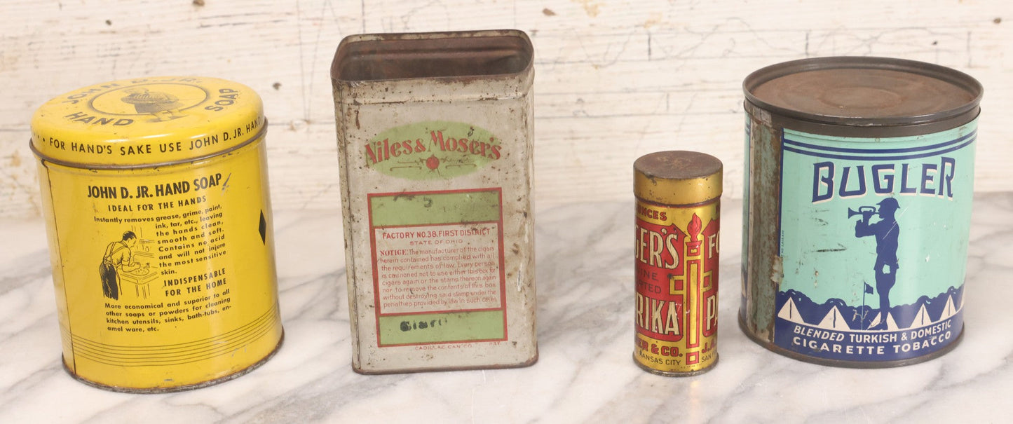 Lot 075 - Four Piece Vintage Tin Grouping Including Bugler Cigarette Tobacco, Niles & Moser's Handmade Quality Cigars, Folger's Paprika, And John D. Jr. Hand Soap