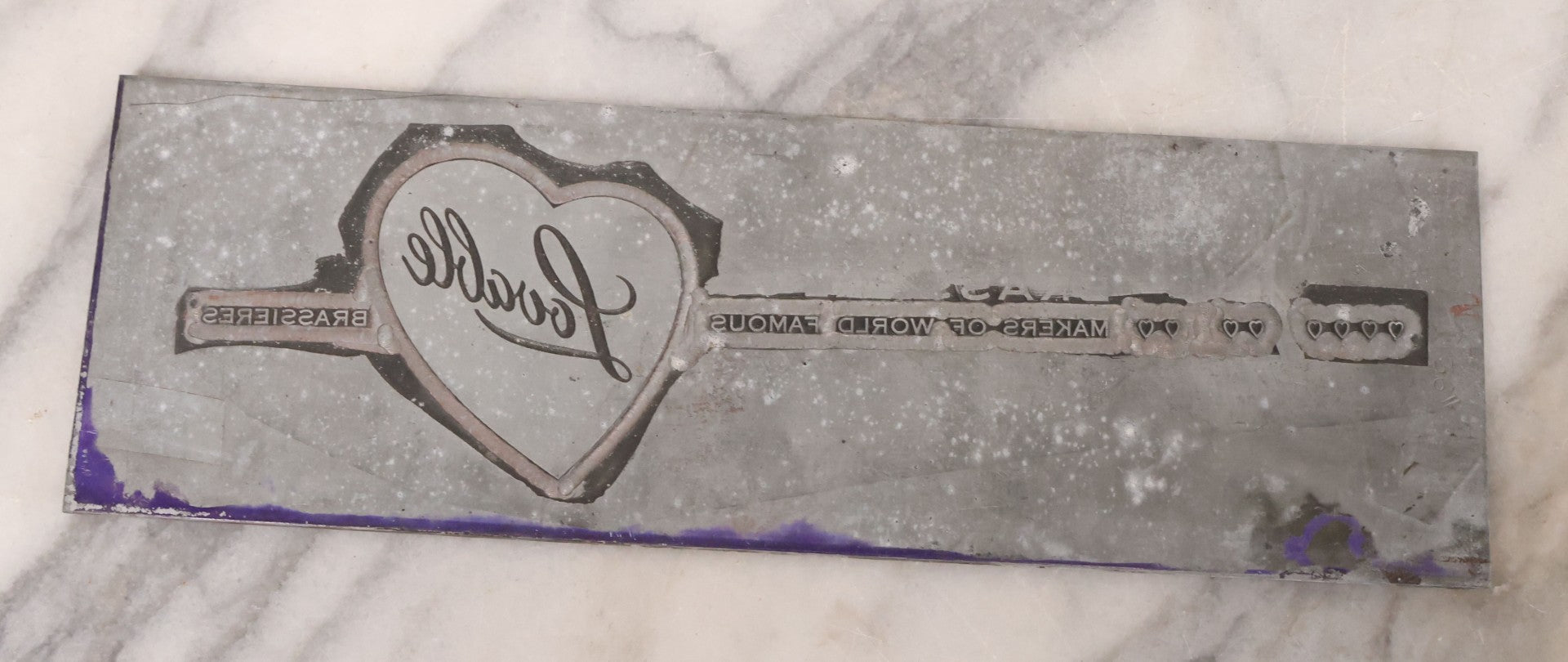 Lot 077 - Grouping Of Four Vintage Metal Printing Plates Including Loveable Brassieres, Surgeons & Physicians Supply Co., Jaw Teasers, And Fragile Stamp