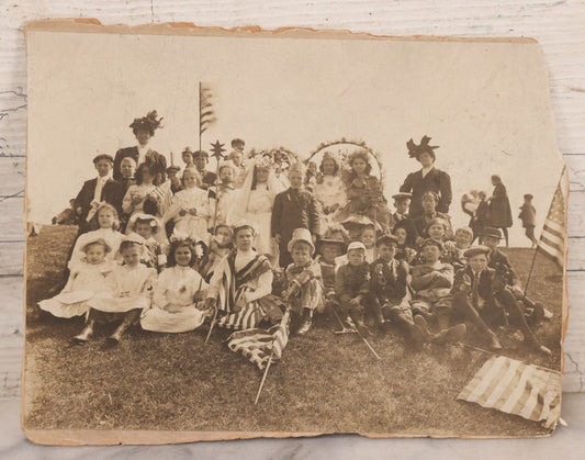 Lot 081 - Antique Trimmed Boarded Photograph Of Patriotic Celebration, Likely Independence Day, With Many Children In Costume Posing With American Flags And Two Adult Women