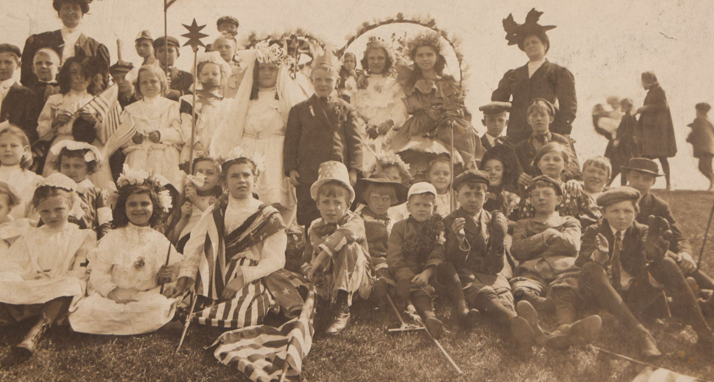 Lot 081 - Antique Trimmed Boarded Photograph Of Patriotic Celebration, Likely Independence Day, With Many Children In Costume Posing With American Flags And Two Adult Women