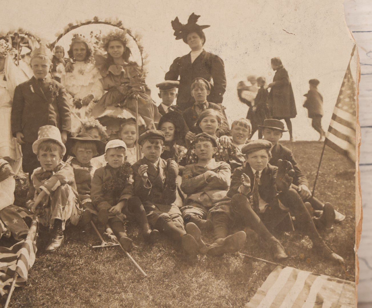 Lot 081 - Antique Trimmed Boarded Photograph Of Patriotic Celebration, Likely Independence Day, With Many Children In Costume Posing With American Flags And Two Adult Women