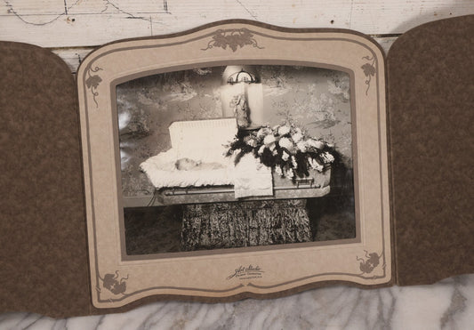 Lot 088 - Vintage Foldered Funeral Photograph Of Elderly Woman In Coffin With Funeral Flowers, From The Art Studio Of Perry Chaloge, Manchester, New Hampshire