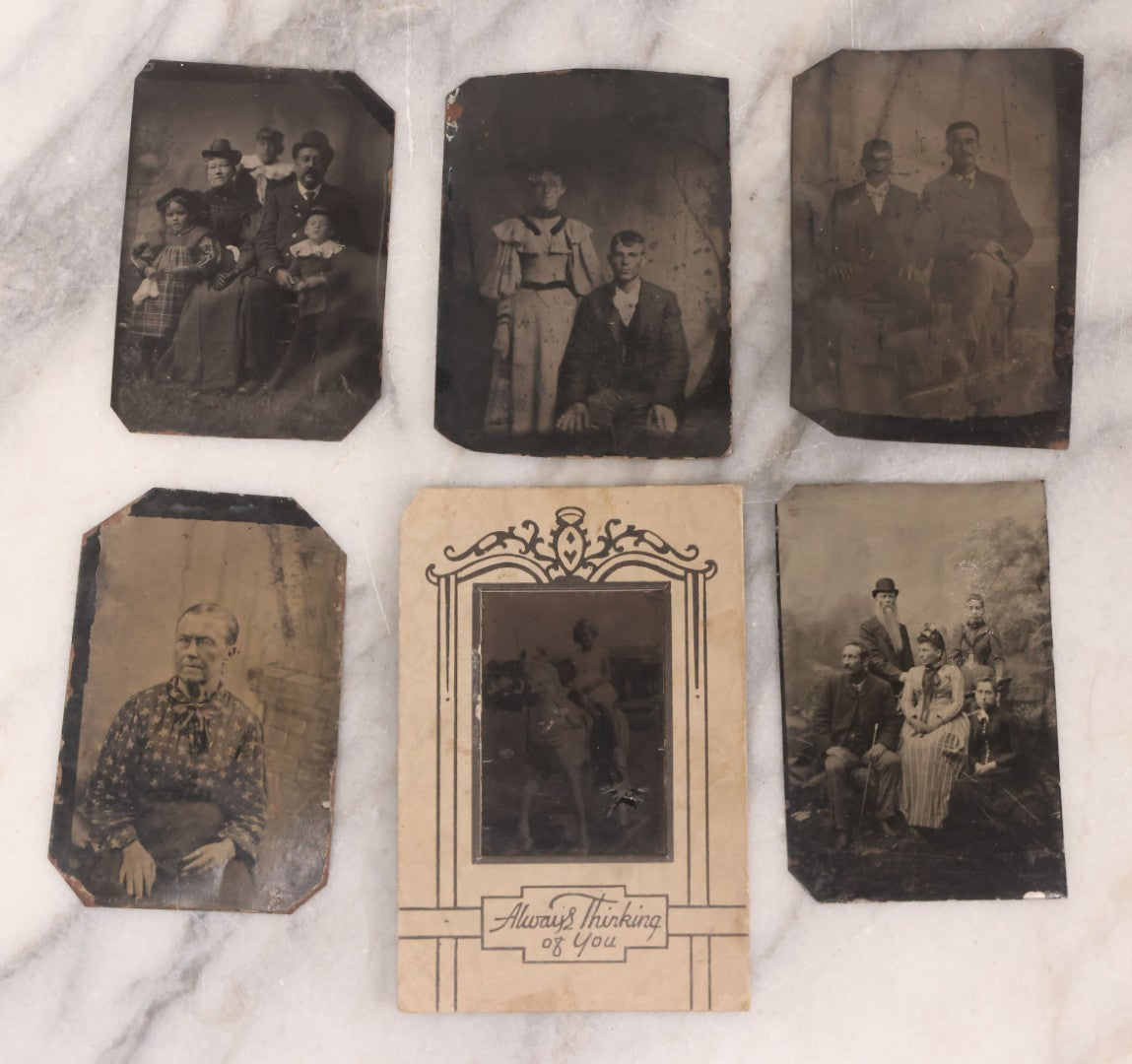 Lot 096 - Grouping Of Six Antique Tintype Photographs Including Souvenir Photo Of Girl On Model Horse, Family Of Five, And Group Photo With Old Man In Bowler Hat With Long White Beard