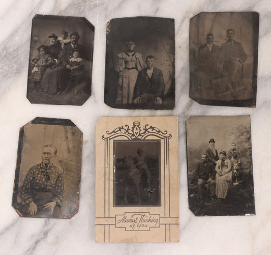 Lot 096 - Grouping Of Six Antique Tintype Photographs Including Souvenir Photo Of Girl On Model Horse, Family Of Five, And Group Photo With Old Man In Bowler Hat With Long White Beard