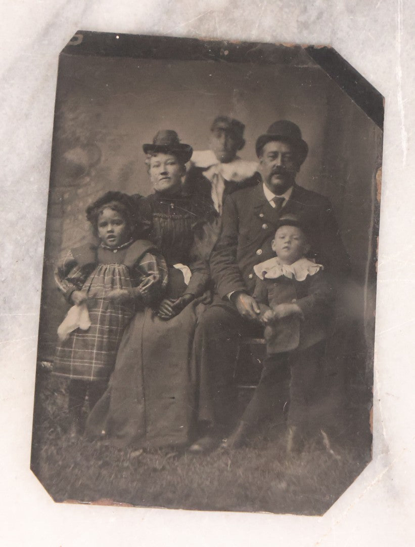 Lot 096 - Grouping Of Six Antique Tintype Photographs Including Souvenir Photo Of Girl On Model Horse, Family Of Five, And Group Photo With Old Man In Bowler Hat With Long White Beard
