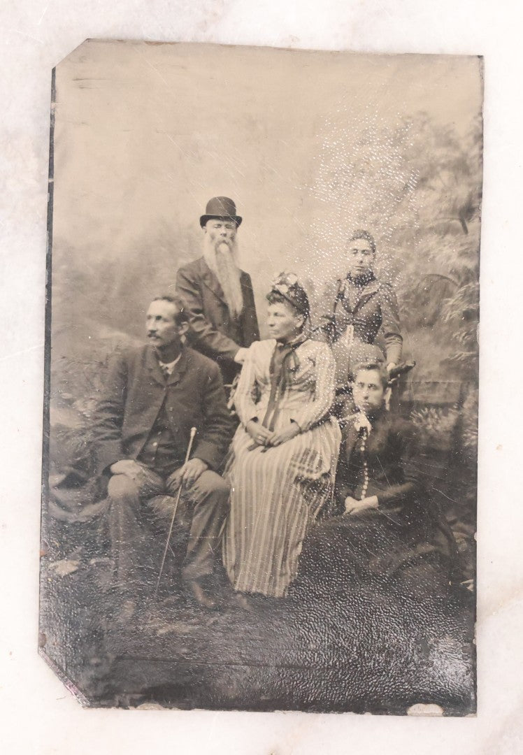 Lot 096 - Grouping Of Six Antique Tintype Photographs Including Souvenir Photo Of Girl On Model Horse, Family Of Five, And Group Photo With Old Man In Bowler Hat With Long White Beard