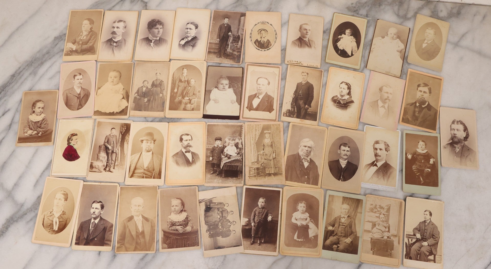 Lot 097 - Grouping Of 41 Carte De Visite C.D.V. Photographs Including Man In Bowler Hat, Man With Stick Cane, And Young Woman With Purple Tinted Dress