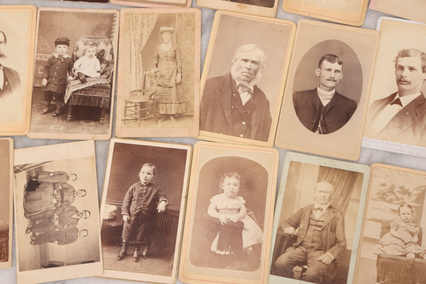 Lot 097 - Grouping Of 41 Carte De Visite C.D.V. Photographs Including Man In Bowler Hat, Man With Stick Cane, And Young Woman With Purple Tinted Dress