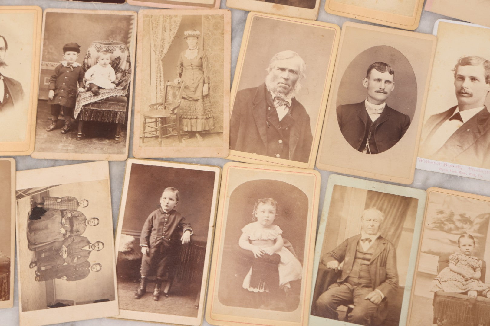 Lot 097 - Grouping Of 41 Carte De Visite C.D.V. Photographs Including Man In Bowler Hat, Man With Stick Cane, And Young Woman With Purple Tinted Dress
