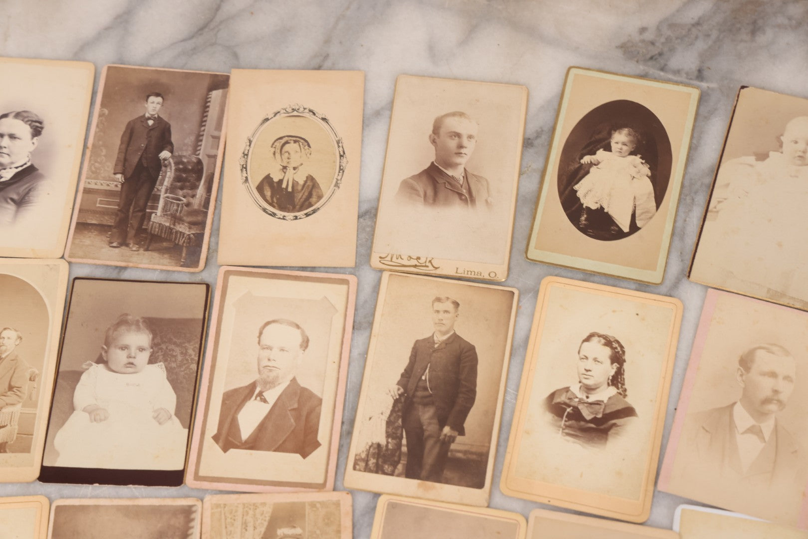 Lot 097 - Grouping Of 41 Carte De Visite C.D.V. Photographs Including Man In Bowler Hat, Man With Stick Cane, And Young Woman With Purple Tinted Dress