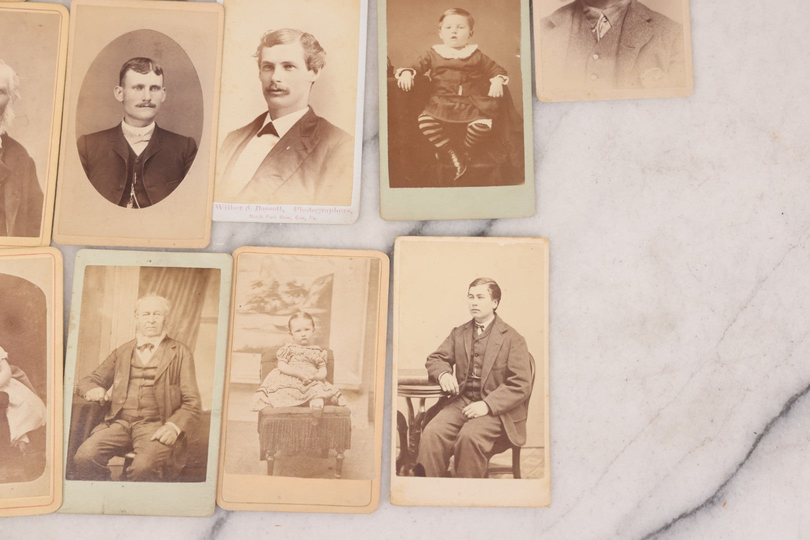 Lot 097 - Grouping Of 41 Carte De Visite C.D.V. Photographs Including Man In Bowler Hat, Man With Stick Cane, And Young Woman With Purple Tinted Dress