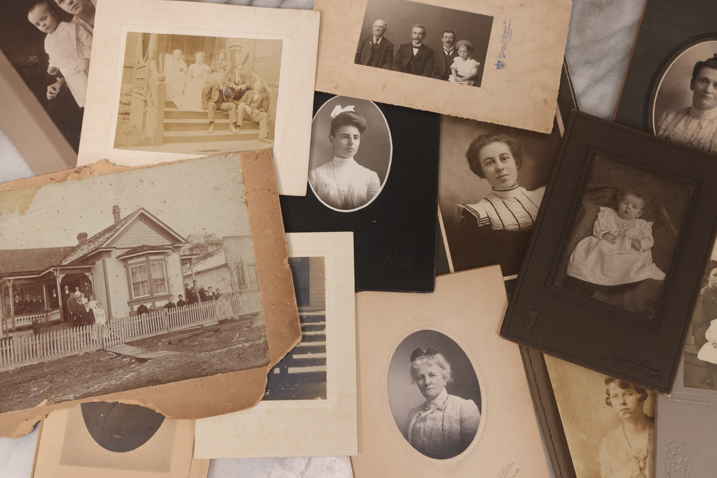 Lot 101 - Grouping Of 27 Vintage And Antique Photographs Including Many Portrait Photos, Two Photos Of Families Posing Outside, Tinted Photo Of Young Blonde Children, And Foldered Photo Of The Crockett Family Band
