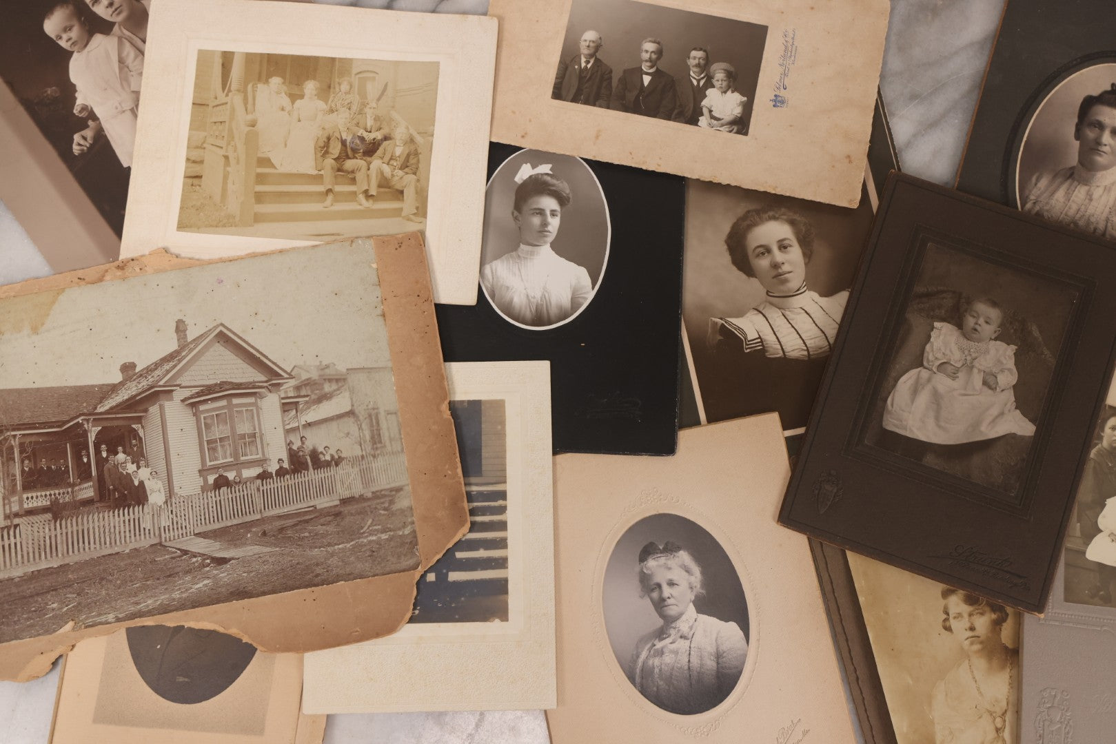 Lot 101 - Grouping Of 27 Vintage And Antique Photographs Including Many Portrait Photos, Two Photos Of Families Posing Outside, Tinted Photo Of Young Blonde Children, And Foldered Photo Of The Crockett Family Band
