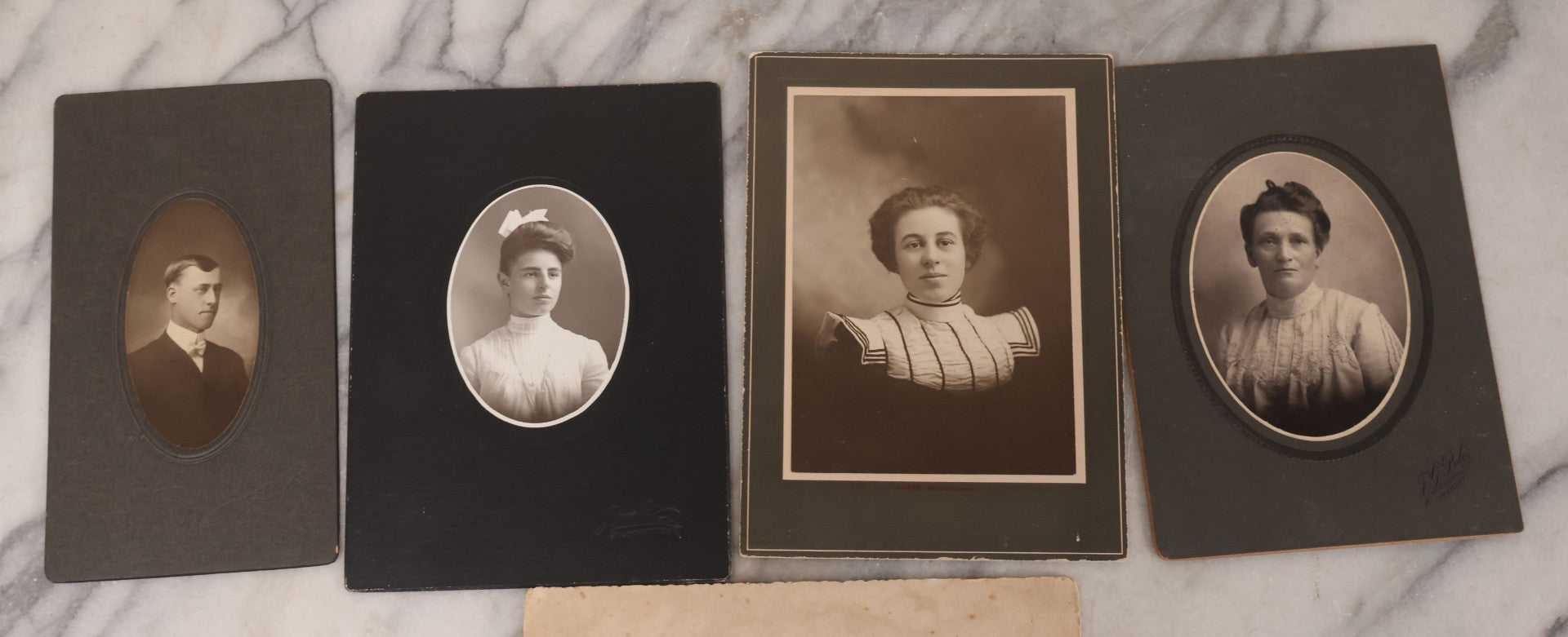 Lot 101 - Grouping Of 27 Vintage And Antique Photographs Including Many Portrait Photos, Two Photos Of Families Posing Outside, Tinted Photo Of Young Blonde Children, And Foldered Photo Of The Crockett Family Band