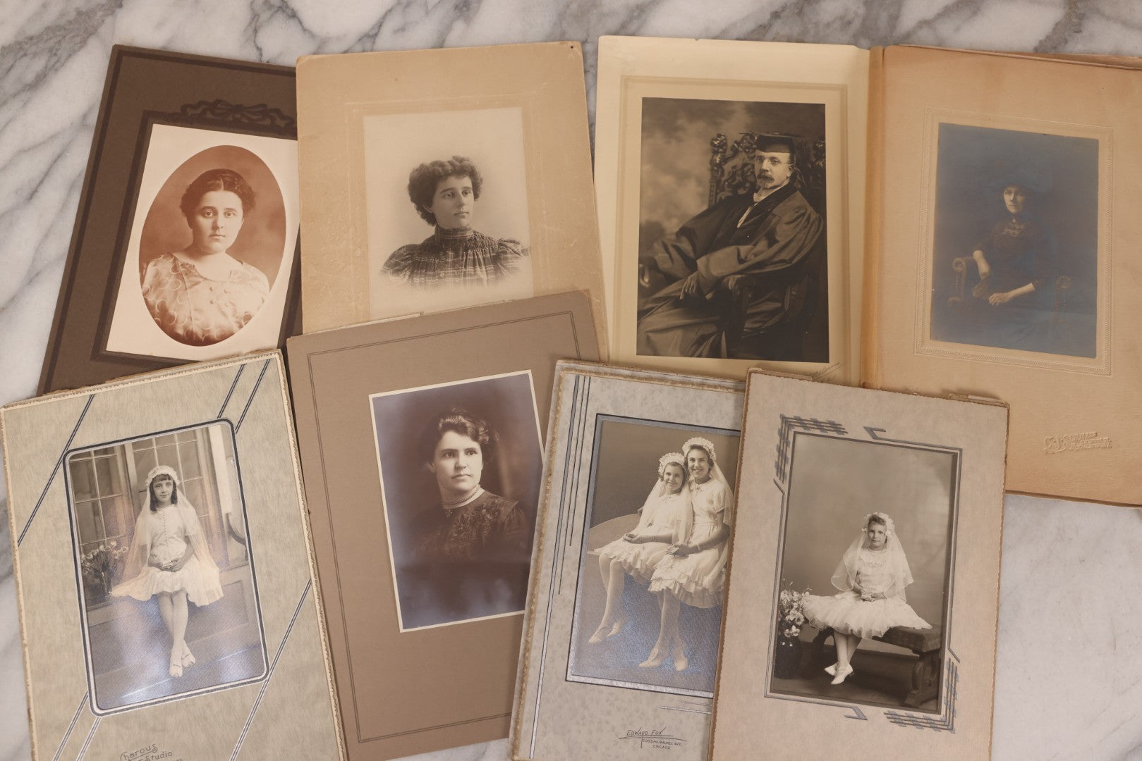 Lot 101 - Grouping Of 27 Vintage And Antique Photographs Including Many Portrait Photos, Two Photos Of Families Posing Outside, Tinted Photo Of Young Blonde Children, And Foldered Photo Of The Crockett Family Band