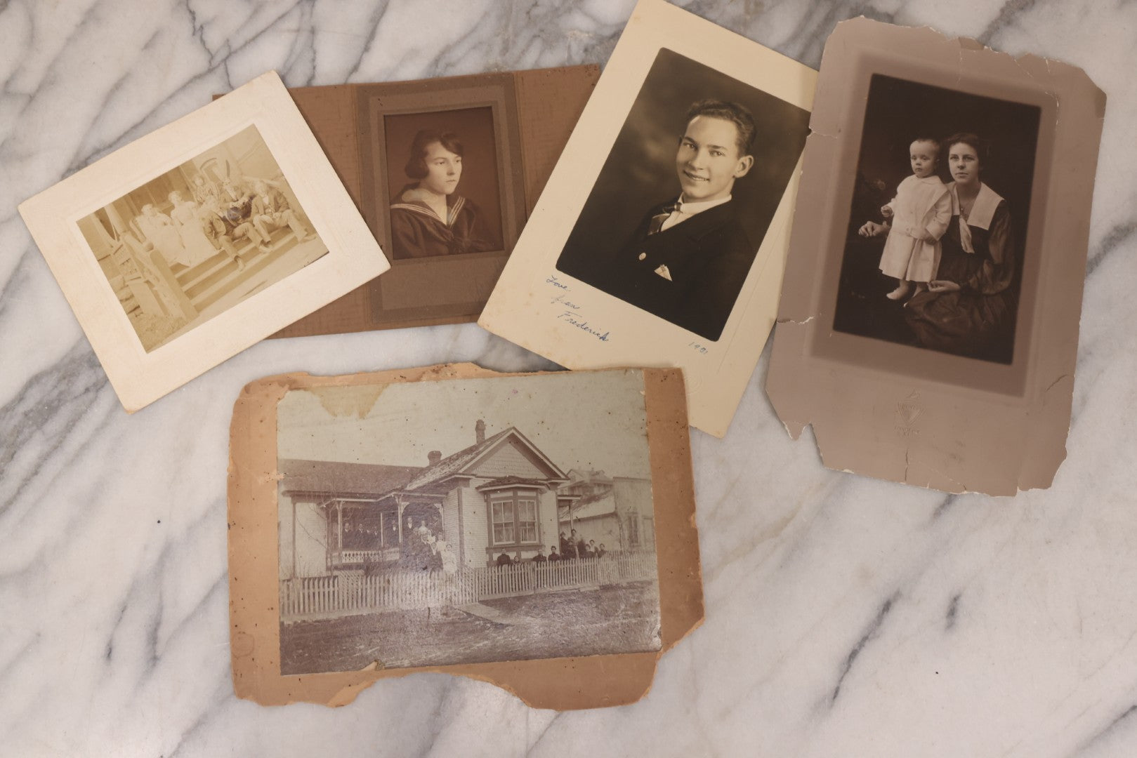 Lot 101 - Grouping Of 27 Vintage And Antique Photographs Including Many Portrait Photos, Two Photos Of Families Posing Outside, Tinted Photo Of Young Blonde Children, And Foldered Photo Of The Crockett Family Band