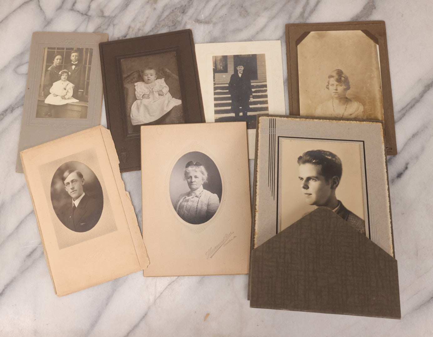 Lot 101 - Grouping Of 27 Vintage And Antique Photographs Including Many Portrait Photos, Two Photos Of Families Posing Outside, Tinted Photo Of Young Blonde Children, And Foldered Photo Of The Crockett Family Band