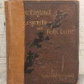 Lot 001 - "New England Legends And Folk Lore In Prose And Poetry" Antique Book By Samuel Adams Drake, Illustrated By F.T. Merrill With Witches On Broomsticks On Cover, Roberts Brothers, Publishers, Boston, 1884, Note Tape On Spine
