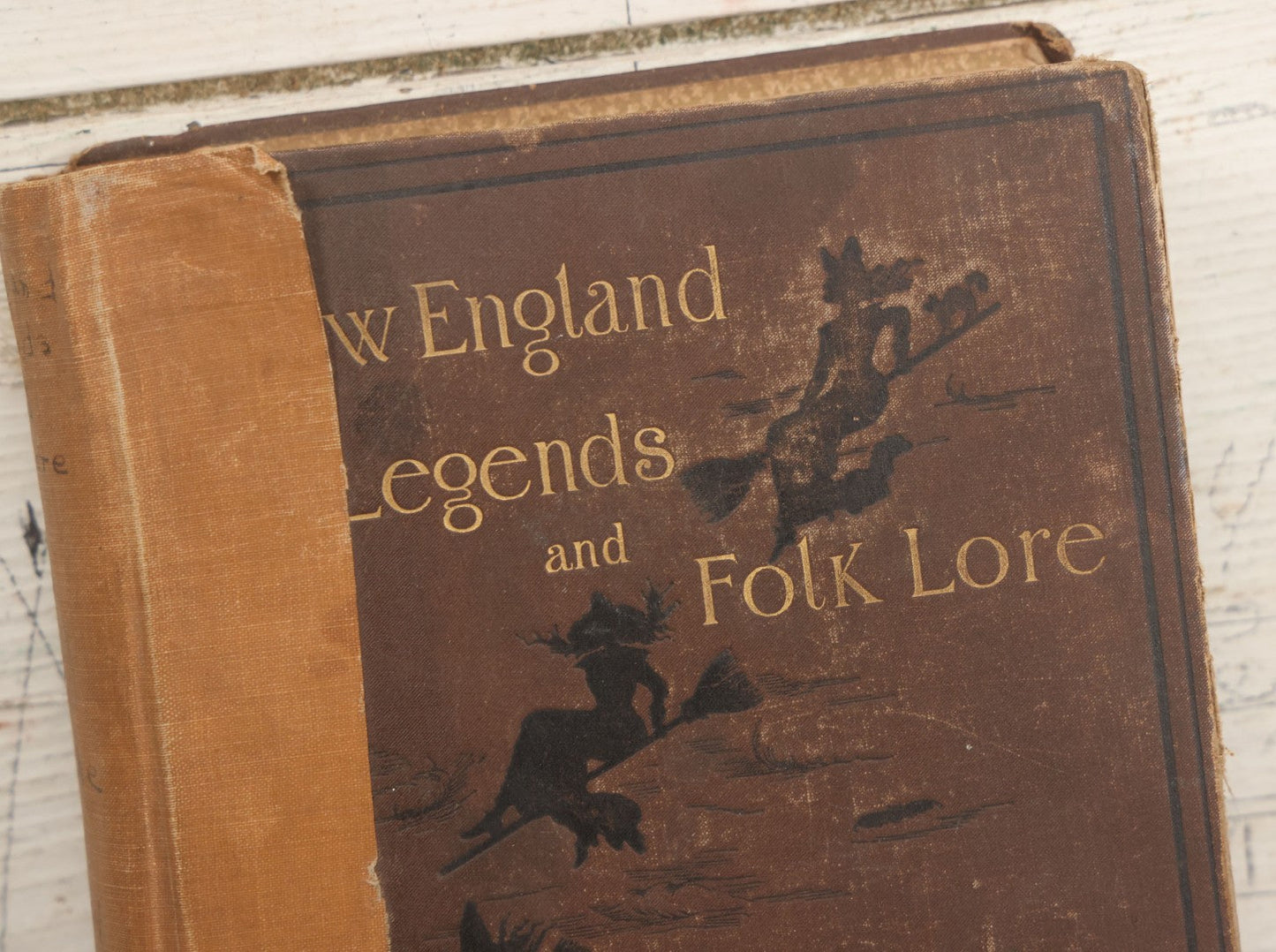 Lot 001 - "New England Legends And Folk Lore In Prose And Poetry" Antique Book By Samuel Adams Drake, Illustrated By F.T. Merrill With Witches On Broomsticks On Cover, Roberts Brothers, Publishers, Boston, 1884, Note Tape On Spine