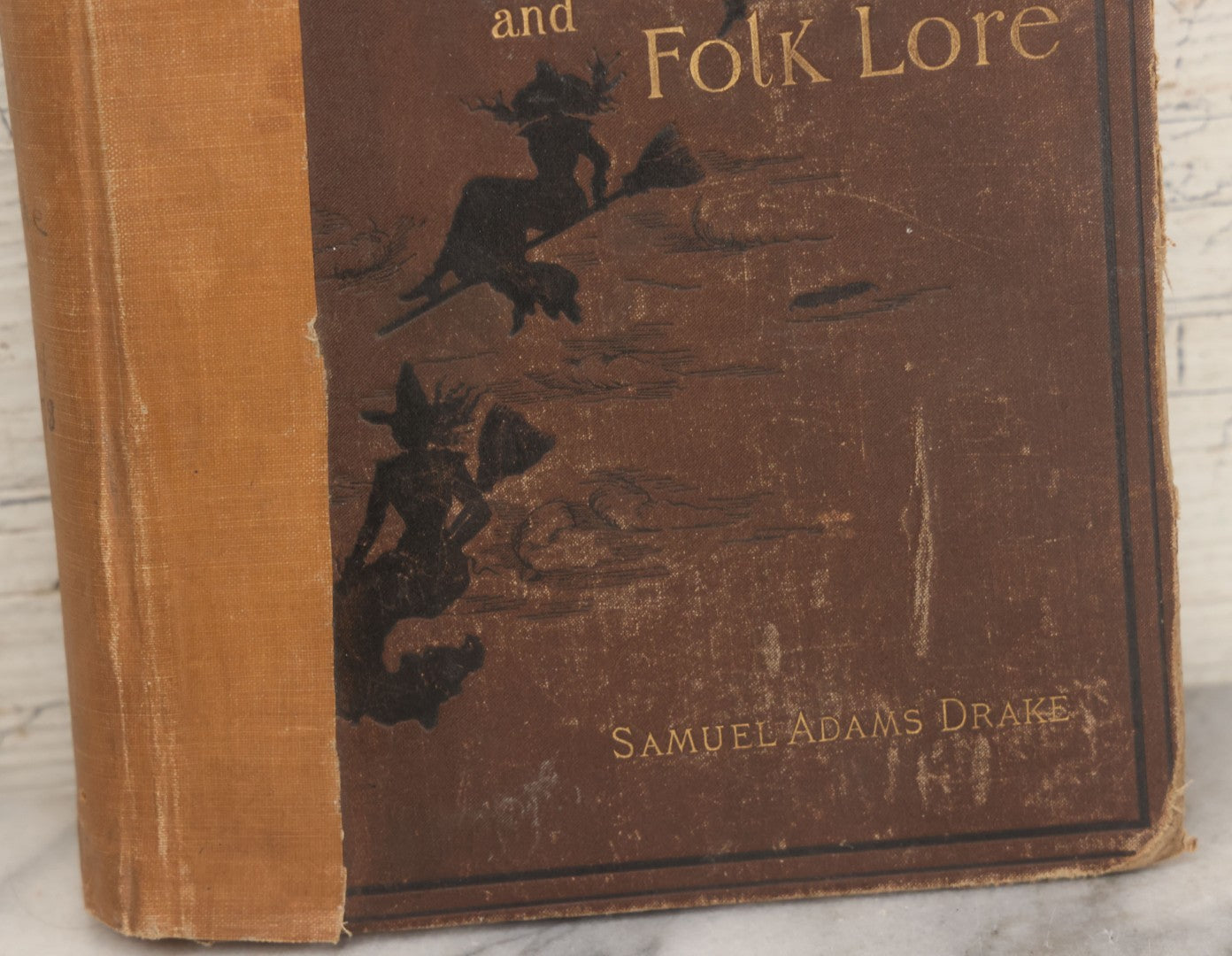 Lot 001 - "New England Legends And Folk Lore In Prose And Poetry" Antique Book By Samuel Adams Drake, Illustrated By F.T. Merrill With Witches On Broomsticks On Cover, Roberts Brothers, Publishers, Boston, 1884, Note Tape On Spine