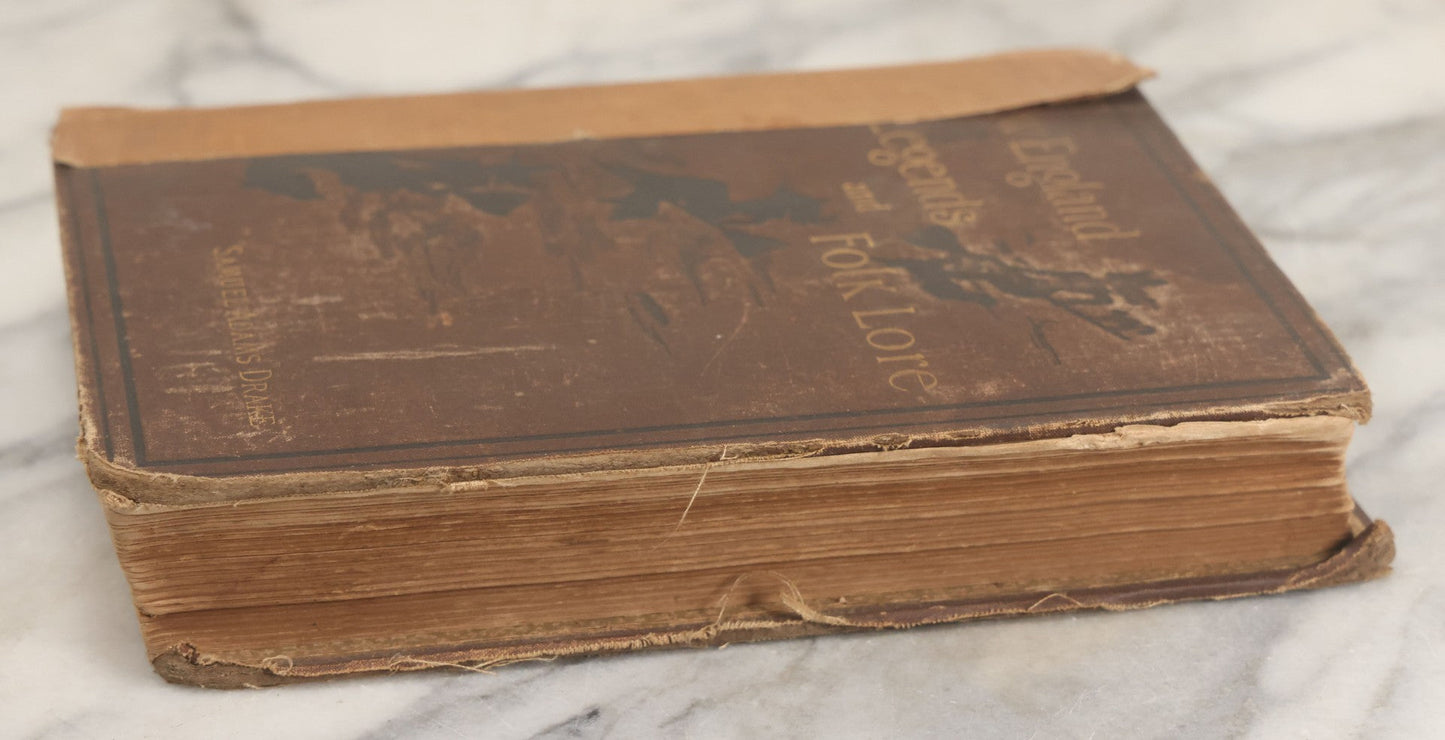 Lot 001 - "New England Legends And Folk Lore In Prose And Poetry" Antique Book By Samuel Adams Drake, Illustrated By F.T. Merrill With Witches On Broomsticks On Cover, Roberts Brothers, Publishers, Boston, 1884, Note Tape On Spine