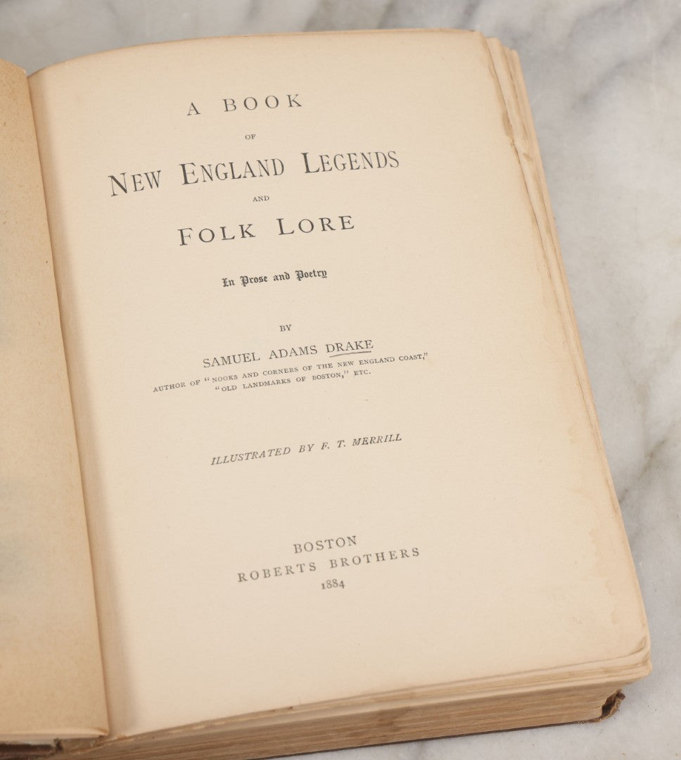 Lot 001 - "New England Legends And Folk Lore In Prose And Poetry" Antique Book By Samuel Adams Drake, Illustrated By F.T. Merrill With Witches On Broomsticks On Cover, Roberts Brothers, Publishers, Boston, 1884, Note Tape On Spine