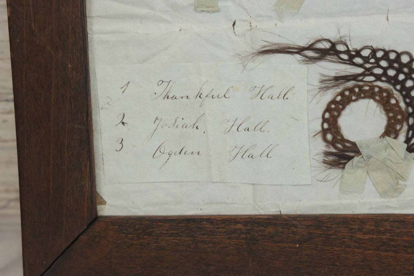 Lot 002 - Antique Victorian Hair Memento Scrap Page With Four Pieces Of Hair Work And Identification Legend, Hair Of Thankful, Josiah, And Ogden Hall, In Frame, 9-3/4" x 7-1/2"