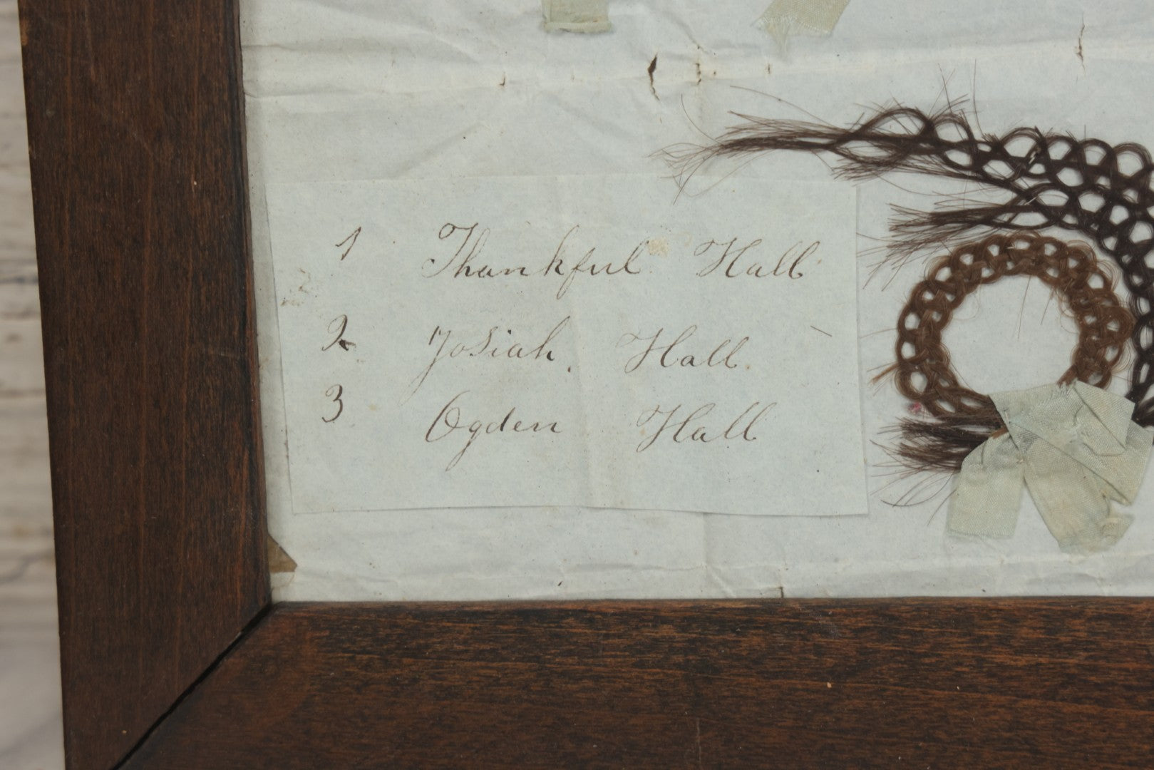 Lot 002 - Antique Victorian Hair Memento Scrap Page With Four Pieces Of Hair Work And Identification Legend, Hair Of Thankful, Josiah, And Ogden Hall, In Frame, 9-3/4" x 7-1/2"