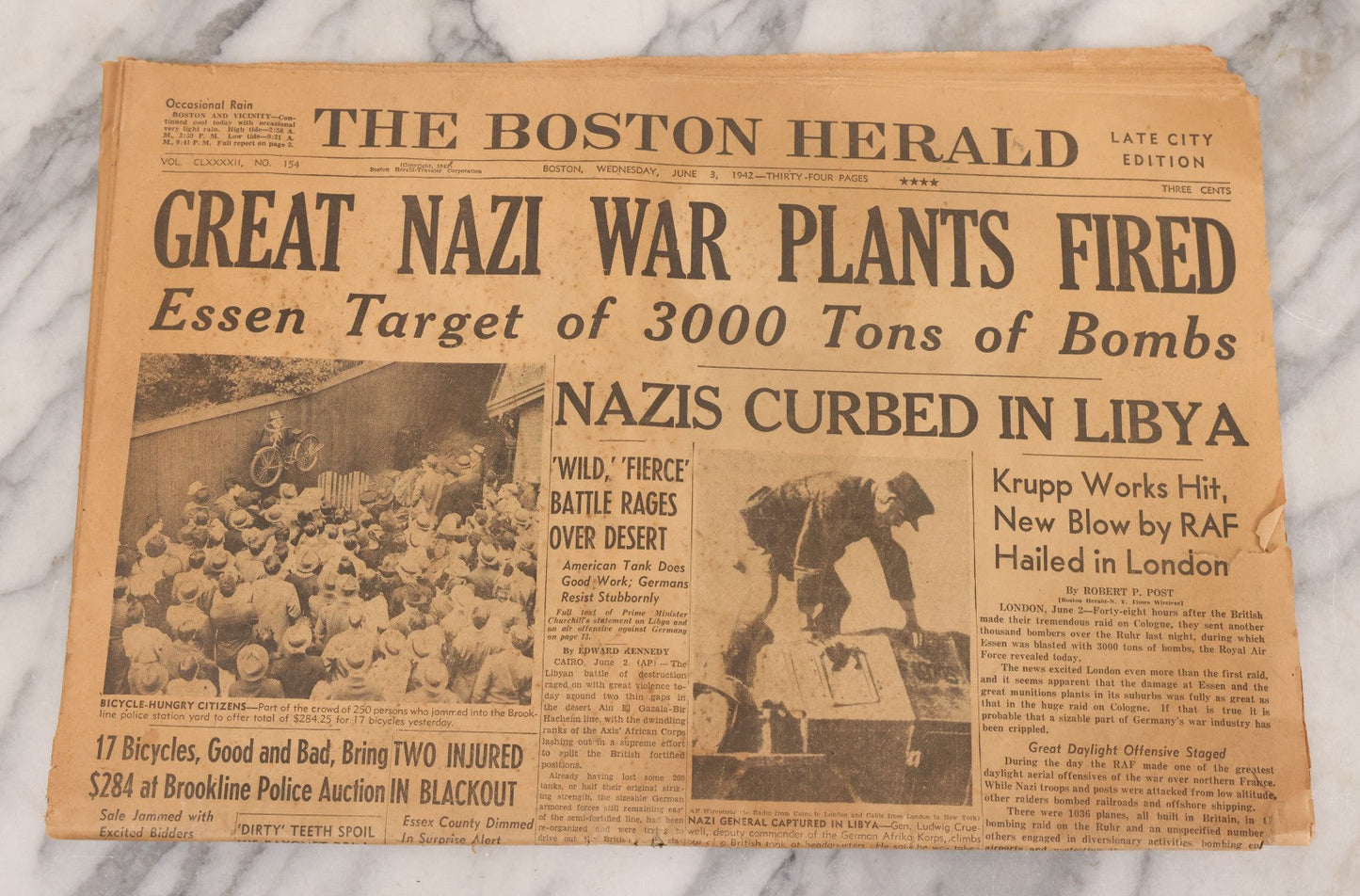 Lot 119 - Grouping Of Six World War Two Era Newspapers From The Boston Metro Area Reporting On Events From During And After The War Against Both The Germans And Japanese, With August 1945 Reporting On Use Of Atom Bomb, Dated 1942 Through 1945