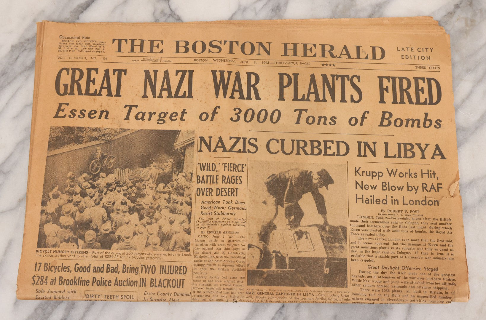 Lot 119 - Grouping Of Six World War Two Era Newspapers From The Boston Metro Area Reporting On Events From During And After The War Against Both The Germans And Japanese, With August 1945 Reporting On Use Of Atom Bomb, Dated 1942 Through 1945