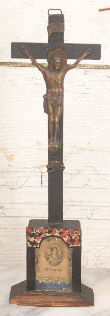 Lot 008 - Antique Wooden Crucifix With Pressed Brass Jesus, Skull Of Adam Skull And Crossbones, And Miniature St. Catharina Memento Shadow Box With Reverse Painted Glass, 11-1/8" Height