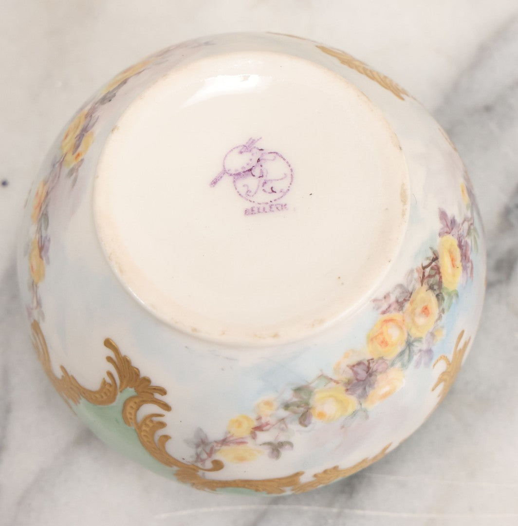 Lot 019 - Antique Hand Painted French Limoges Porcelain Dresser Box With Painting Of Brunette Woman In Extravagant Hat On Lid, With Yellow Painted Flowers, Artist Signed L.C.K. Dated 1894, With Purple "Belleek" Hallmark