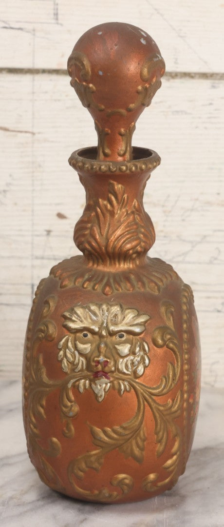 Lot 028 - Antique Hand Painted Baroque Renaissance Revival White Glass Decanter With Copper And Gold Paint, Ornate Grotesque Lion Mask Motif And Foliate Scrolls, Applied Flower Decal, And Original Matching Stopper, Circa 1900, 10-5/8" Height