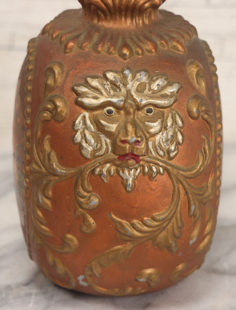 Lot 028 - Antique Hand Painted Baroque Renaissance Revival White Glass Decanter With Copper And Gold Paint, Ornate Grotesque Lion Mask Motif And Foliate Scrolls, Applied Flower Decal, And Original Matching Stopper, Circa 1900, 10-5/8" Height