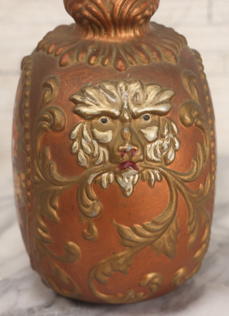 Lot 028 - Antique Hand Painted Baroque Renaissance Revival White Glass Decanter With Copper And Gold Paint, Ornate Grotesque Lion Mask Motif And Foliate Scrolls, Applied Flower Decal, And Original Matching Stopper, Circa 1900, 10-5/8" Height
