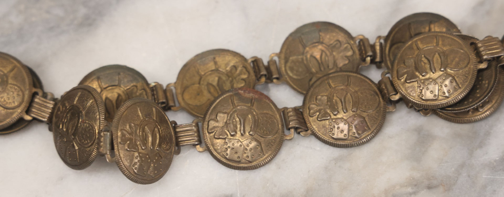 Lot 048 - Vintage Pressed Brass Good Luck Charm Necklace With Four Leaf Clover, Lucky Penny, Dice, Horseshoe, And Wishbone, With Fifteen Pressed "Coins"